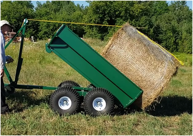 MUTS ATV/ UTV side by side utility trailer loading a round hay bale